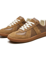 Front view of men's lace-up sneaker showing rounded toe and reinforced eyelets