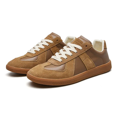 Front view of men's lace-up sneaker showing rounded toe and reinforced eyelets