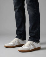Rear view of men's low-top sneaker showing heel panel and outsole edge