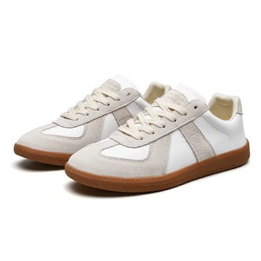 Close-up of contrast stitching across the toe and side panels of the sneaker