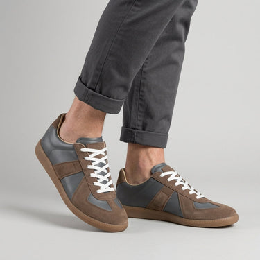 Flat lay of both sneakers showing the panelled upper and flat rubber outsole