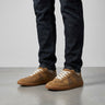 Men's low-top lace-up sneaker with panelled upper and contrast stitching, side view