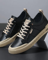 Close-up of lace-up front fastening on men's low-top trainer