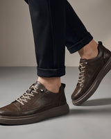 Close-up of the multiple eyelet lace-up closure on men's low-top boots