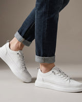 Side view of men's lace-up boots showing stitched panel detail and thick textured sole