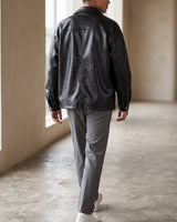 Front view of a loose-fit men's leather biker jacket
