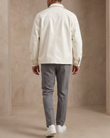Men's leather biker jacket worn in a casual urban setting