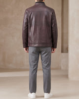 Three-quarter view of the leather jacket showing the overall loose fit