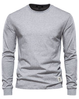 Side view of a men's long sleeve polo shirt showing the straight hem