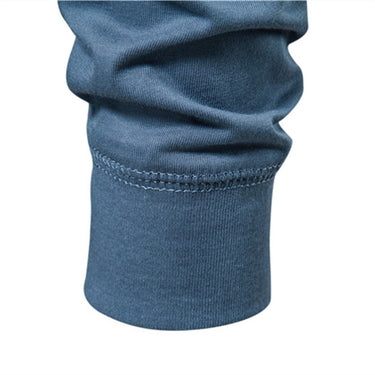 Full-length view of men's long sleeve Henley T-shirt with straight hem