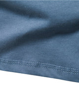 Detail shot of button placket on a men's Henley T-shirt