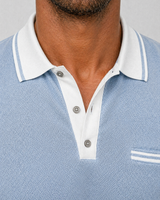 Close-up of contrast collar trim and button placket detail on polo shirt