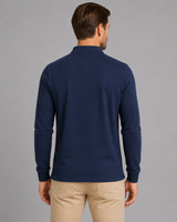 Men's long sleeve polo shirt showing ribbed cuffs and side vents, side view