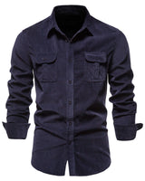 Close-up of buttoned flap chest pockets on men's woven shirt