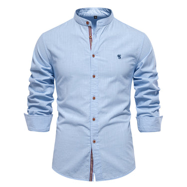 Detail shot of the button closure on a men's mandarin collar shirt
