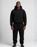 Side view showing the relaxed silhouette of the hoodie and joggers