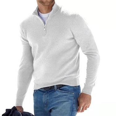 Layered styling with the quarter-zip jumper worn under a coat
