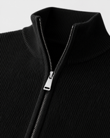 Side profile of men's zip up cardigan showing regular fit and hem