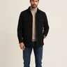 Men's flannel overshirt with button front and spread collar, worn casually