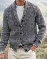 Model wearing men's shawl collar cardigan open over a shirt