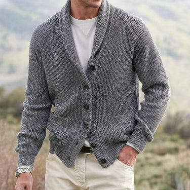 Model wearing men's shawl collar cardigan open over a shirt