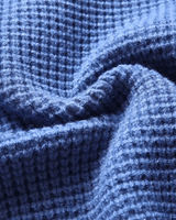 Side view of men's cashmere button-front cardigan showing silhouette