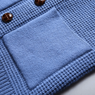 Close-up of button fastening row on men's cashmere cardigan