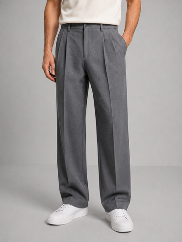Back view of men's tailored trousers showing flush back pockets and clean finish