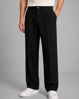 Detail shot of front pleat and waistband on men's straight-leg trousers
