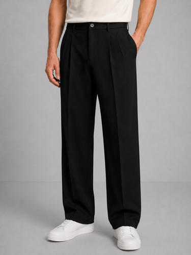 Detail shot of front pleat and waistband on men's straight-leg trousers