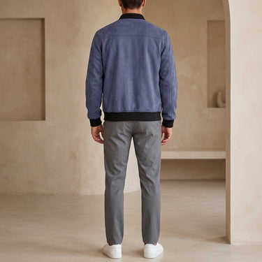 Men's suede bomber jacket showing ribbed cuffs and zip fastening detail