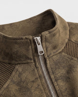 Side view of the short faux leather bomber jacket showing ribbed hem and cuffs