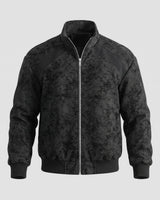 Full-length view of the men's faux leather bomber jacket styled with casual trousers