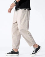 Detail shot of the adjustable drawstring waistband and articulated panelling