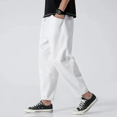 Back view of the cropped tapered trousers showing the clean hem and leg line