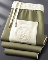 Overhead flat-lay of the jacket and joggers laid out together