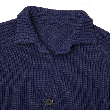 Three-quarter view of men's waffle-knit cardigan with stand collar and buttons