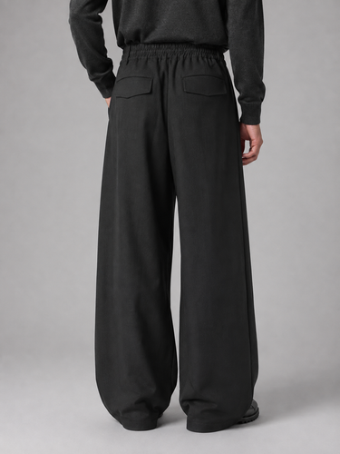 Close-up of tailored waistband with belt loops and button-zip fastening