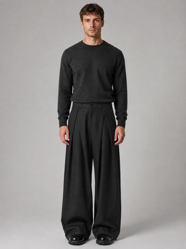 Side view showing the wide leg cut and drape of the trousers