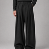 Front view of men's wide leg trousers showing full-length silhouette and front pleats