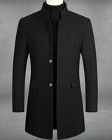 Side profile of a men's tailored wool overcoat showing the structured silhouette
