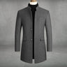 Front view of a slim tailored wool overcoat with a standing collar and button-through fastening