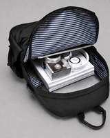 Close-up of the USB charging port on the side of the backpack
