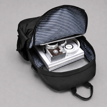 Close-up of the USB charging port on the side of the backpack