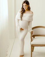 Side view showing the full-length silhouette of the white maternity dress
