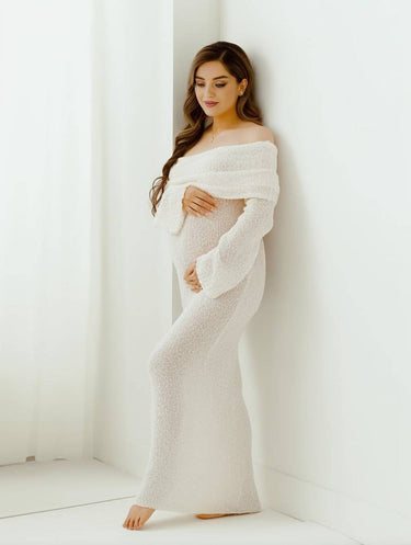 Close-up of the off-shoulder neckline and long sleeve detail in white