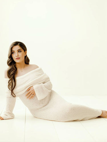 Model wearing the apricot off-shoulder maternity dress, full-length front view