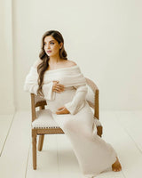 Side profile of the apricot maternity dress highlighting the flowing fit around the bump