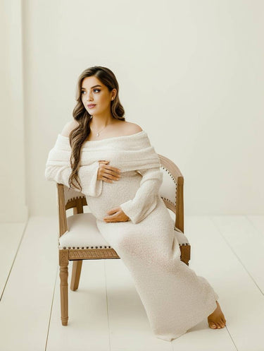 Side profile of the apricot maternity dress highlighting the flowing fit around the bump