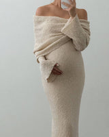 Detail shot of the hem and skirt drape of the off-shoulder maternity dress